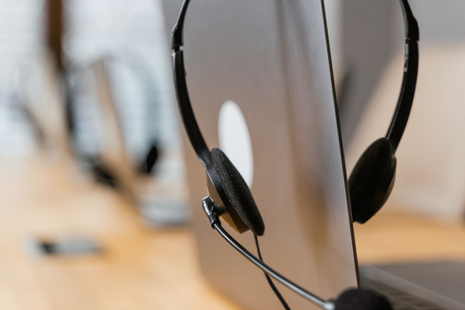 Headset on a monitor representing an AI collections agent